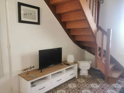 Télévision ou salle de divertissement dans l'établissement Ti Laouen - maison cocooning vue mer