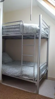Un ou plusieurs lits dans un hébergement de l'établissement Maison de vacances 3* à 50m de la plage
