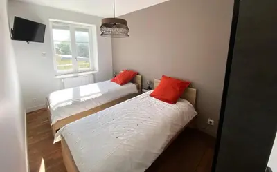 Un ou plusieurs lits dans un hébergement de l'établissement Saint-Pol maison familiale avec jardin équipée à neuf 12 personnes