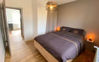 Un ou plusieurs lits dans un hébergement de l'établissement Saint-Pol maison familiale avec jardin équipée à neuf 12 personnes