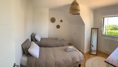 Un ou plusieurs lits dans un hébergement de l'établissement La Maison Des Sables Blancs