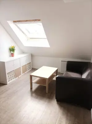 Coin salon dans l'établissement Charmant appartement proche commerces et plages