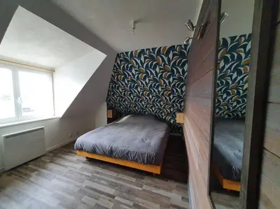 Un ou plusieurs lits dans un hébergement de l'établissement Charmant appartement proche commerces et plages