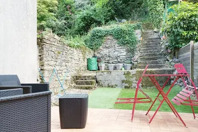 Jardin de l'établissement oo Le jardin oo paisible studio équipé et bien placé