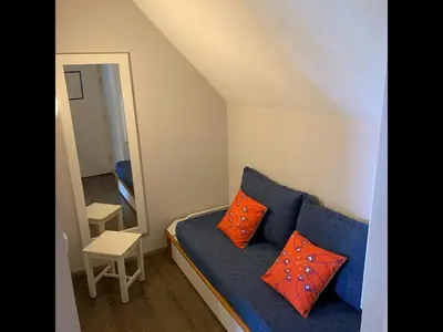 Coin salon dans l'établissement Le Petit Fort - Duplex avec Piscine