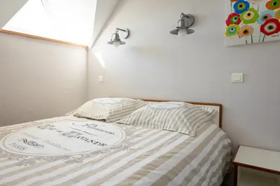 Un ou plusieurs lits dans un hébergement de l'établissement Le Petit Fort - Duplex avec Piscine