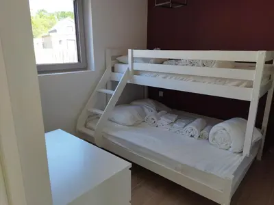 Un ou plusieurs lits dans un hébergement de l'établissement Les cabines du bout du monde Plain pied votre pied à terre breton haut standing