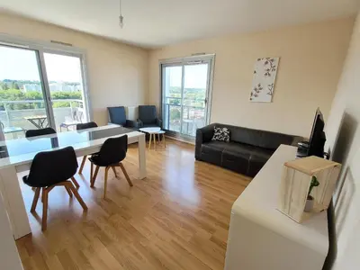 Coin salon dans l'établissement Appartement T5 proche tramway