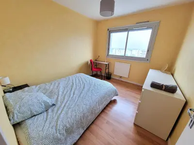 Un ou plusieurs lits dans un hébergement de l'établissement Appartement T5 proche tramway