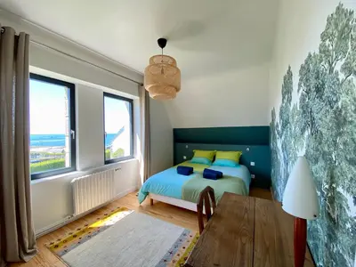 Un ou plusieurs lits dans un hébergement de l'établissement Superbe villa vue sur mer, corniche de la plage