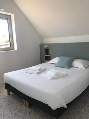 Un ou plusieurs lits dans un hébergement de l'établissement Les cabines du bout du monde - Cabine Duplex , votre maison de vacances de haut standing à Crozon