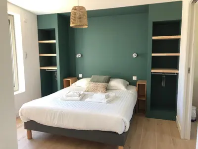 Un ou plusieurs lits dans un hébergement de l'établissement Les cabines du bout du monde - Cabine Duplex , votre maison de vacances de haut standing à Crozon