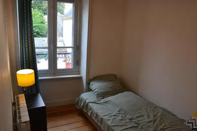 Un ou plusieurs lits dans un hébergement de l'établissement Ker Melen I Hyper centre et jardin