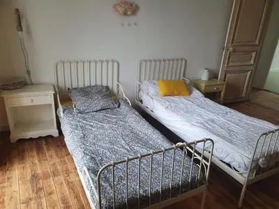 Un ou plusieurs lits dans un hébergement de l'établissement Ti ar chorneg, maison de vacances bretagne entre mer et mont d'arrée