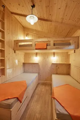 Un ou plusieurs lits dans un hébergement de l'établissement Le Jardin Saint Germain Lodges and Events