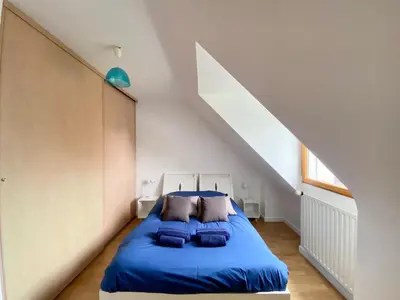 Un ou plusieurs lits dans un hébergement de l'établissement Magnifique maison avec piscine à Beg Meil
