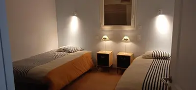 Un ou plusieurs lits dans un hébergement de l'établissement maison de la plage des Amiets