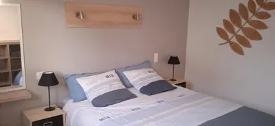 Un ou plusieurs lits dans un hébergement de l'établissement maison de la plage des Amiets