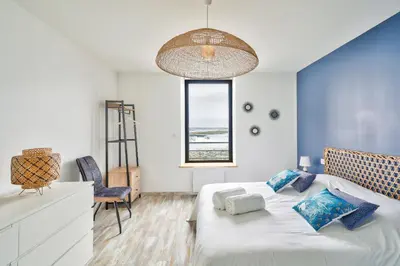 Un ou plusieurs lits dans un hébergement de l'établissement Appartement 4 personnes avec vue mer