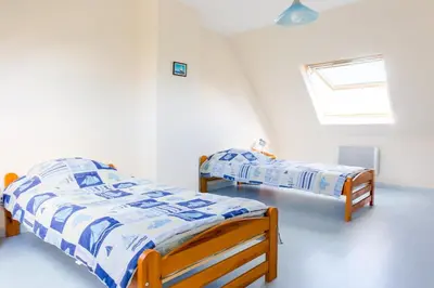 Un ou plusieurs lits dans un hébergement de l'établissement Maison pour 6 au coeur du Pays Bigouden