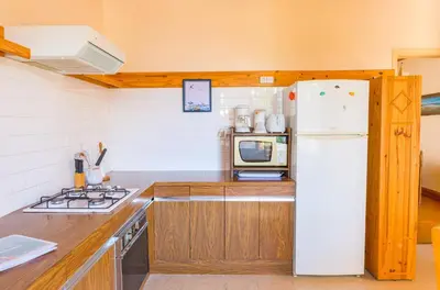 Cuisine ou kitchenette dans l'établissement Maison de famille pour 6 personnes