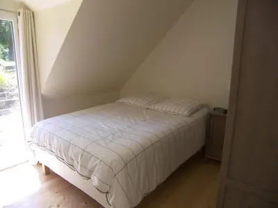 Un ou plusieurs lits dans un hébergement de l'établissement Un Jardin en Pente Douce