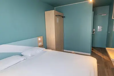 Un ou plusieurs lits dans un hébergement de l'établissement Ibis budget Brest Sud Plougastel - Hôtel rénové