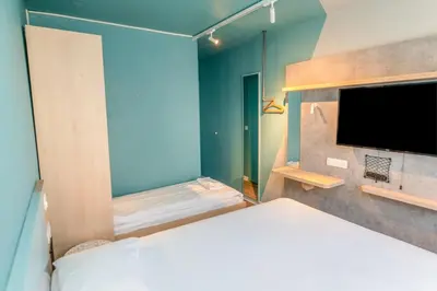 Un ou plusieurs lits dans un hébergement de l'établissement Ibis budget Brest Sud Plougastel - Hôtel rénové