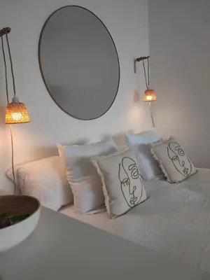 Un ou plusieurs lits dans un hébergement de l'établissement LA SUITE appartement pleine vue mer