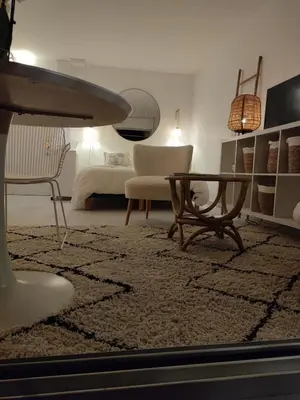 Télévision ou salle de divertissement dans l'établissement LA SUITE appartement pleine vue mer