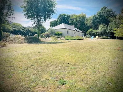 Jardin de l'établissement Maison spacieuse à deux pas de la plage