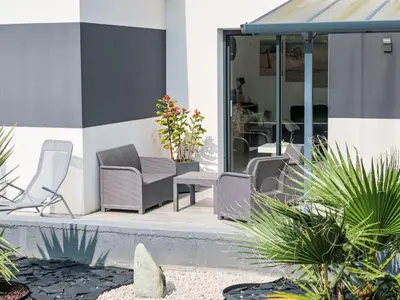 Coin salon dans l'établissement Holiday Home Palet Breton by Interhome