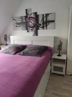 Un ou plusieurs lits dans un hébergement de l'établissement Chez la Québécoise - chambre d'hôtes