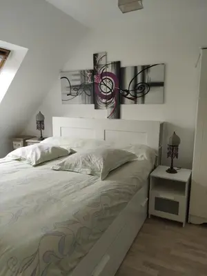 Un ou plusieurs lits dans un hébergement de l'établissement Chez la Québécoise - chambre d'hôtes