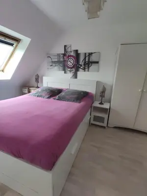 Un ou plusieurs lits dans un hébergement de l'établissement Chez la Québécoise - chambre d'hôtes