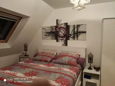 Un ou plusieurs lits dans un hébergement de l'établissement Chez la Québécoise - chambre d'hôtes