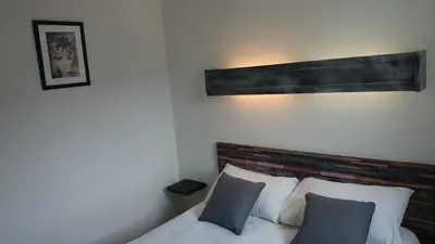 Un ou plusieurs lits dans un hébergement de l'établissement Hotel TGV