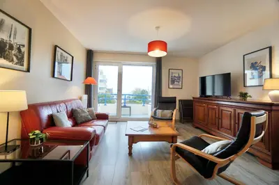 Télévision ou salle de divertissement dans l'établissement Le duplex du quai mer