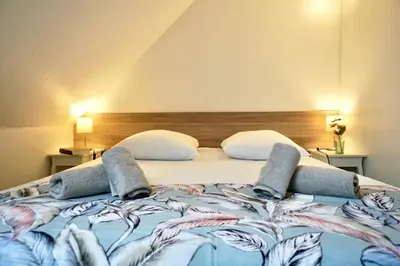 Un ou plusieurs lits dans un hébergement de l'établissement Le duplex du quai mer
