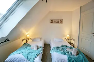 Un ou plusieurs lits dans un hébergement de l'établissement Le duplex du quai mer