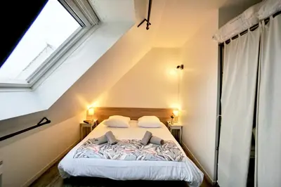 Un ou plusieurs lits dans un hébergement de l'établissement Le duplex du quai mer