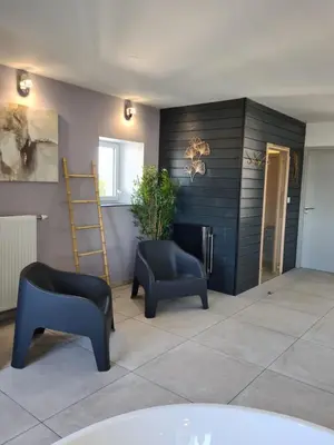 Coin salon dans l'établissement Les Suites du Dossen