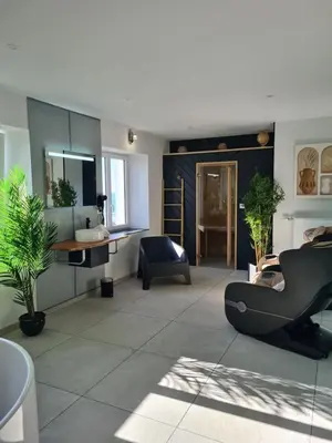 Coin salon dans l'établissement Les Suites du Dossen