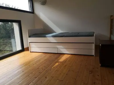 Un ou plusieurs lits dans un hébergement de l'établissement Appartement accueillant au cœur de Le Conquet avec parking privé