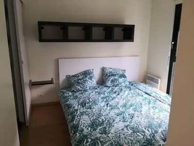 Un ou plusieurs lits dans un hébergement de l'établissement Appartement accueillant au cœur de Le Conquet avec parking privé