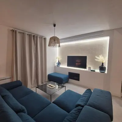 Coin salon dans l'établissement LoveRoom La Parenthèse Secrète