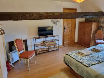 Un ou plusieurs lits dans un hébergement de l'établissement chambre d'hôtes vue sur jardin