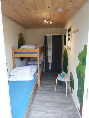 Un ou plusieurs lits dans un hébergement de l'établissement Hébergements camping 