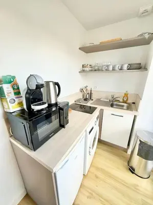 Cuisine ou kitchenette dans l'établissement Appartements meublés Brest Gay Lussac