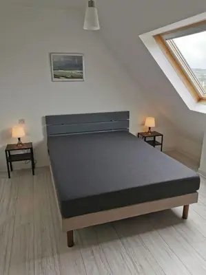 Un ou plusieurs lits dans un hébergement de l'établissement Maison de vacances proche des plages et du GR34